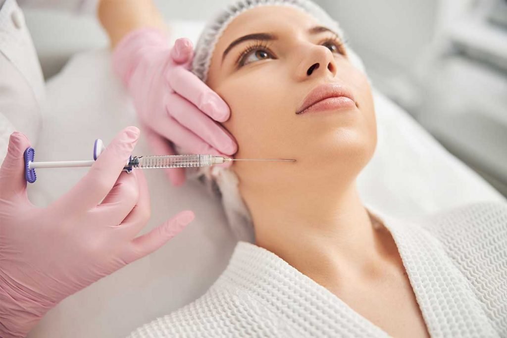 young woman getting cosmetic injection