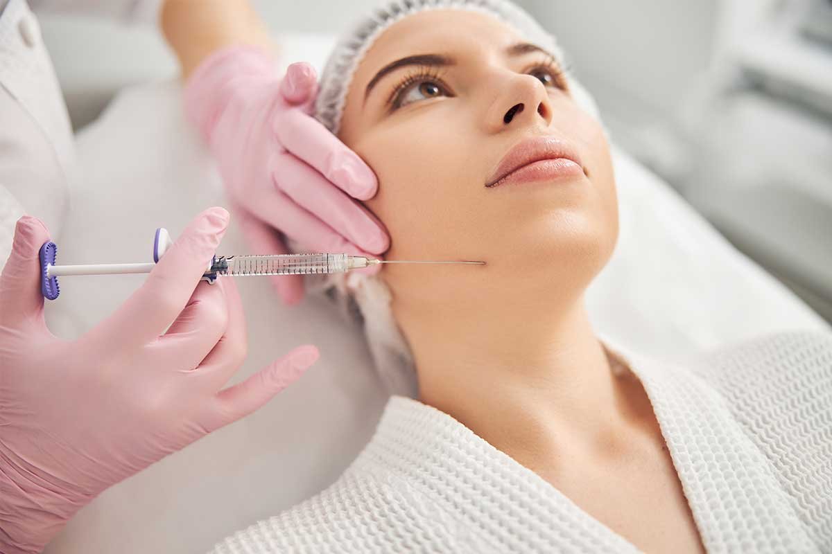 young woman getting cosmetic injection