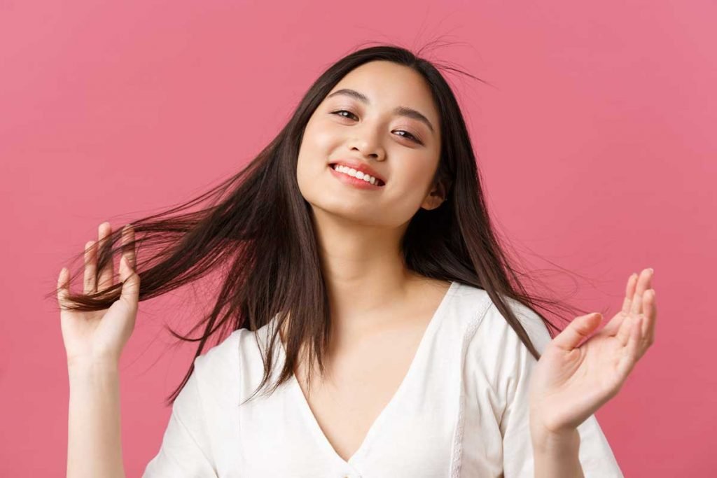 happy women flaunting her healthy hair